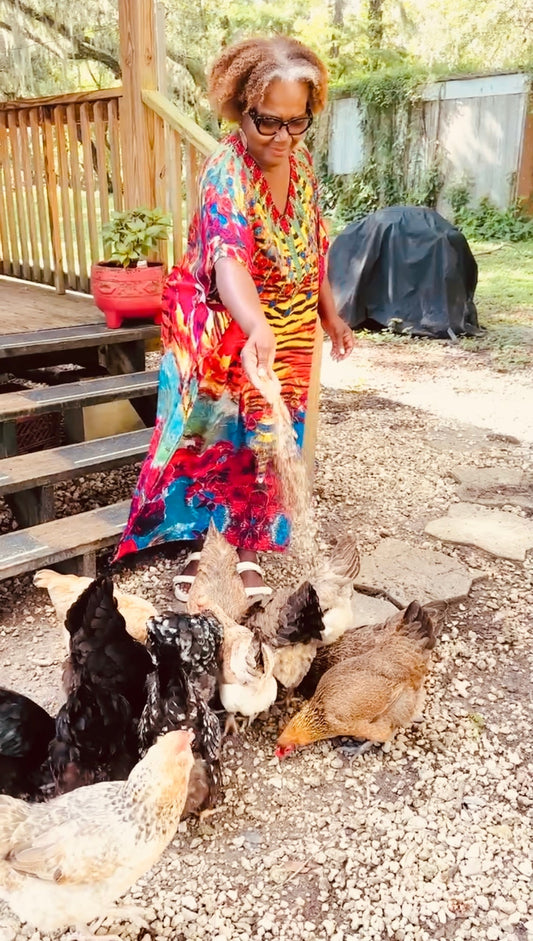 Marcia Allene, author,  and the welcoming committee at a Farm in Plant City, FL