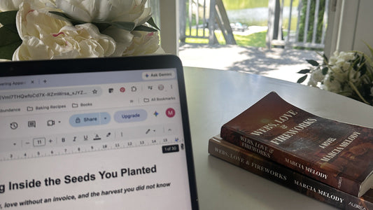 "Draft of The Internal Verandah essay on a laptop screen, with white peonies, Webs Love and Fireworks novels, and a lake view in the background