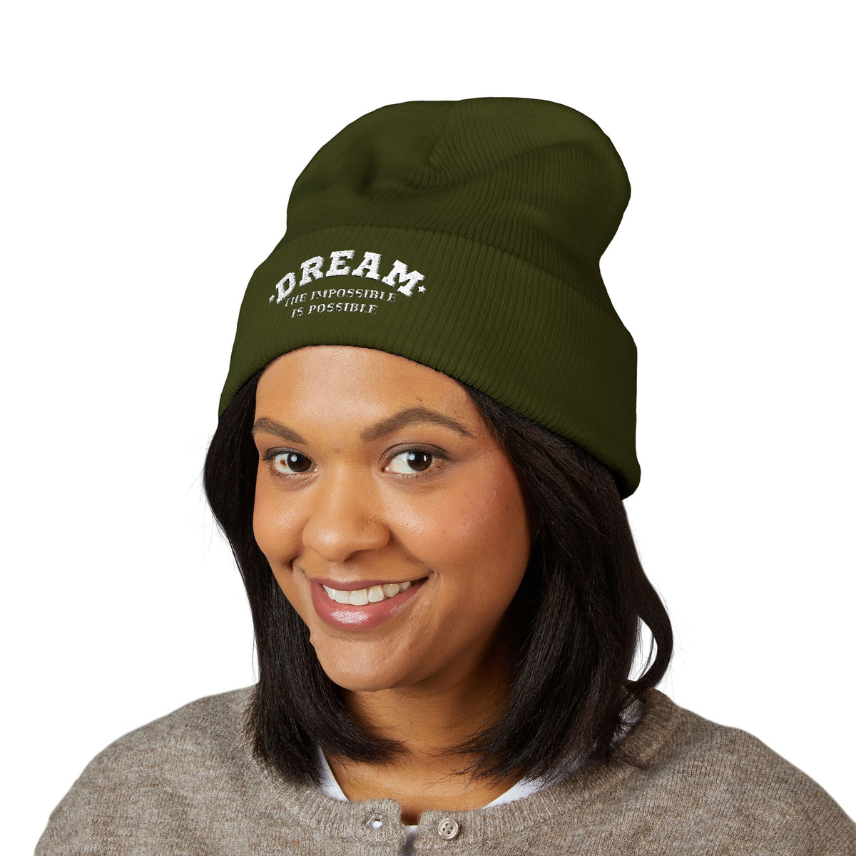 Woman wearing the Dream The Impossible Is Possible embroidered cuffed beanie, Olive