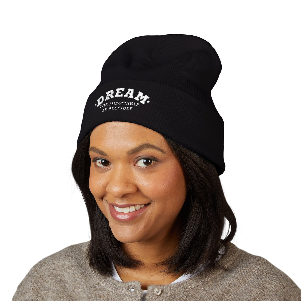 Woman wearing the Dream The Impossible Is Possible embroidered cuffed beanie, Black